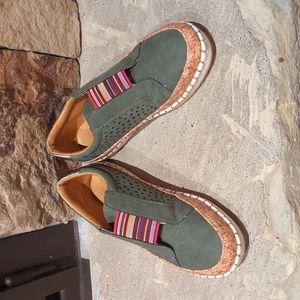 Green slip on sneakers